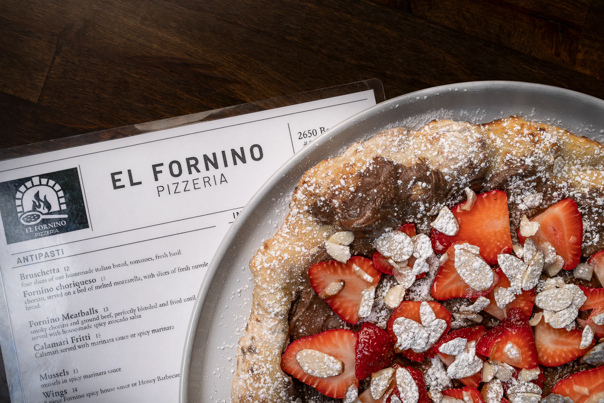 Nutella Pizza made at El Fornino along side a menu